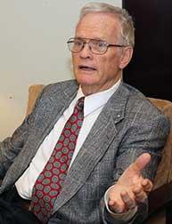 Dr. McCoy speaking while seated