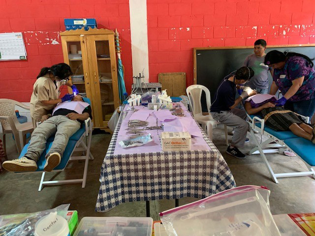 Dr. Yagi works with Dr. Bob Sekijima (’84) during a humanitarian mission in Guatemala in August 2019.